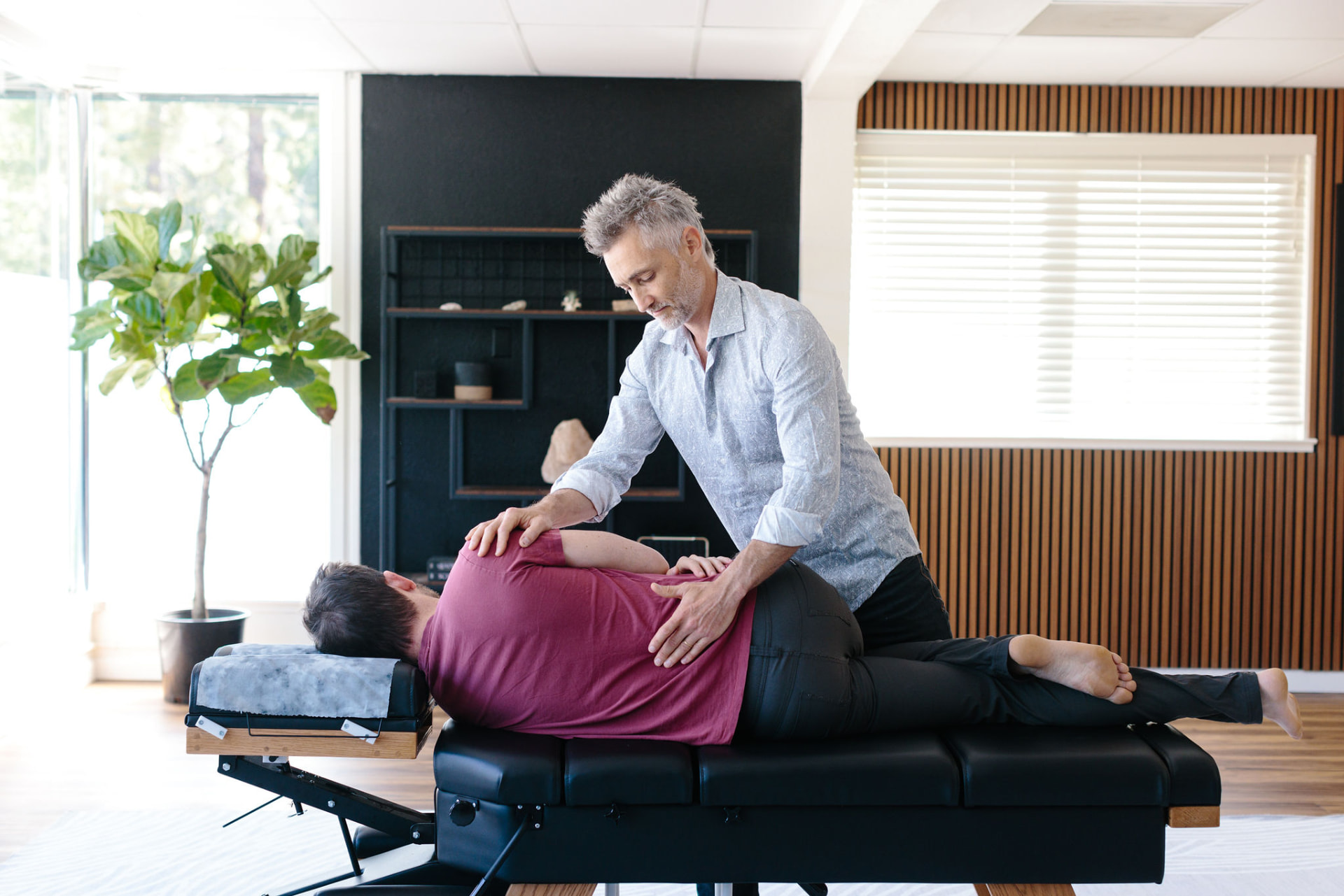 Dr. Martin Henderson adjusting a patient's lower back at Threefold Chiropractic in San Anselmo